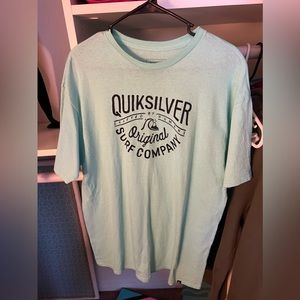 Blue/green looking shirt, second picture is more accurate for color